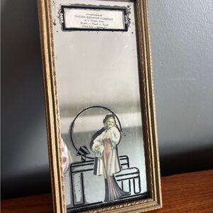 Elegant Gold Framed Mirror with Art Deco Illustration